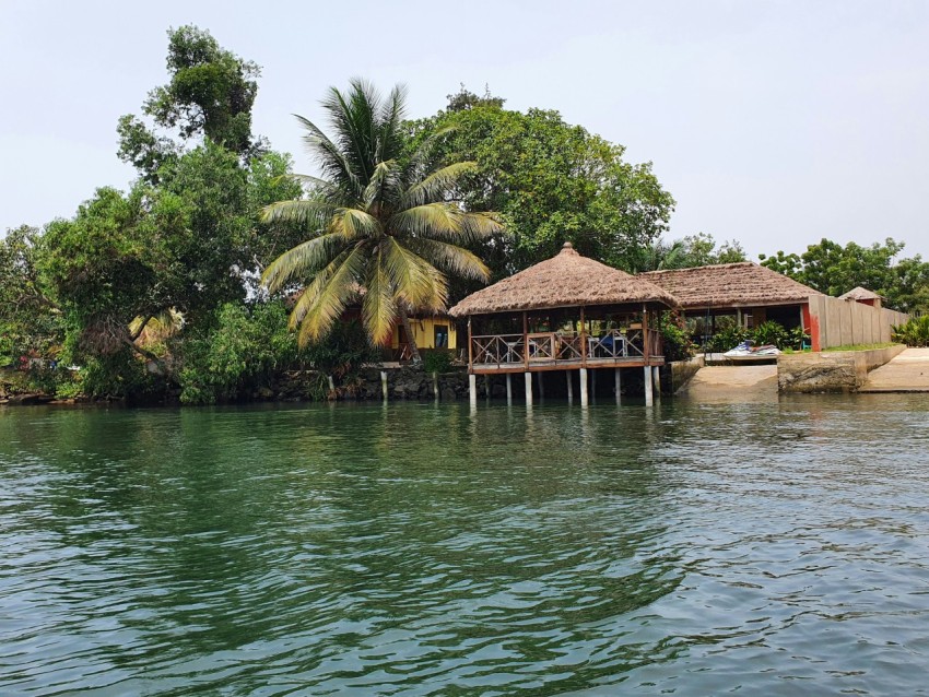 a house on the shore of a body of water