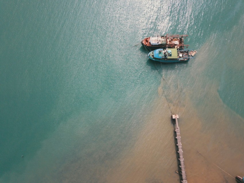 two boats docked near port in aerial photography