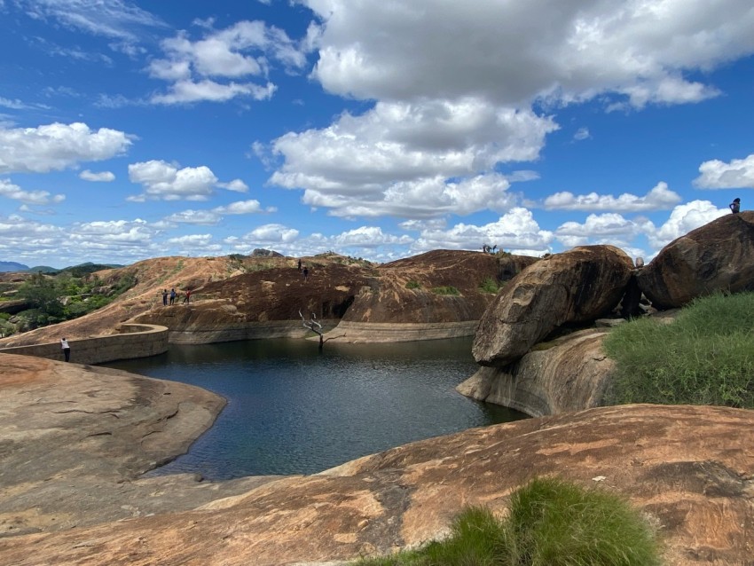 a large body of water surrounded by large rocks