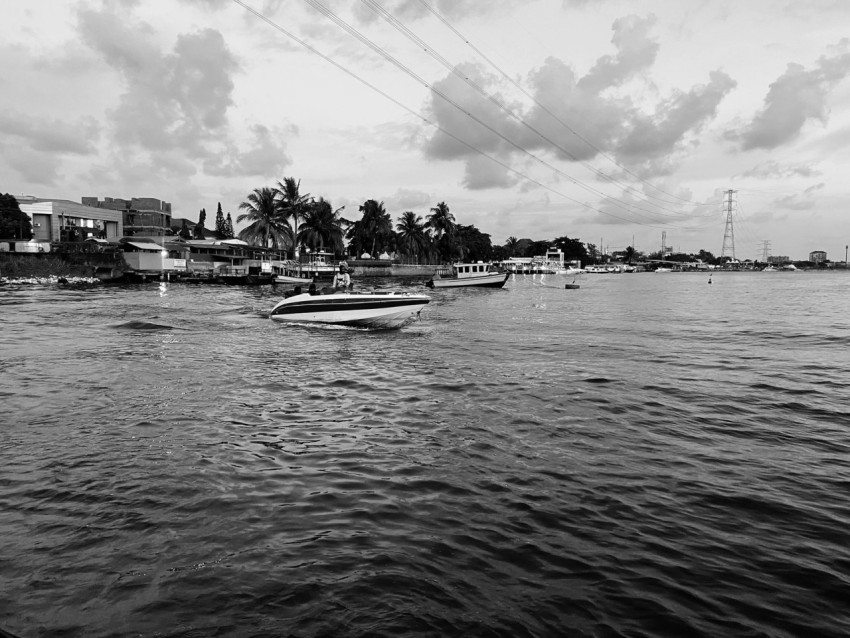 a black and white photo of a boat in the water