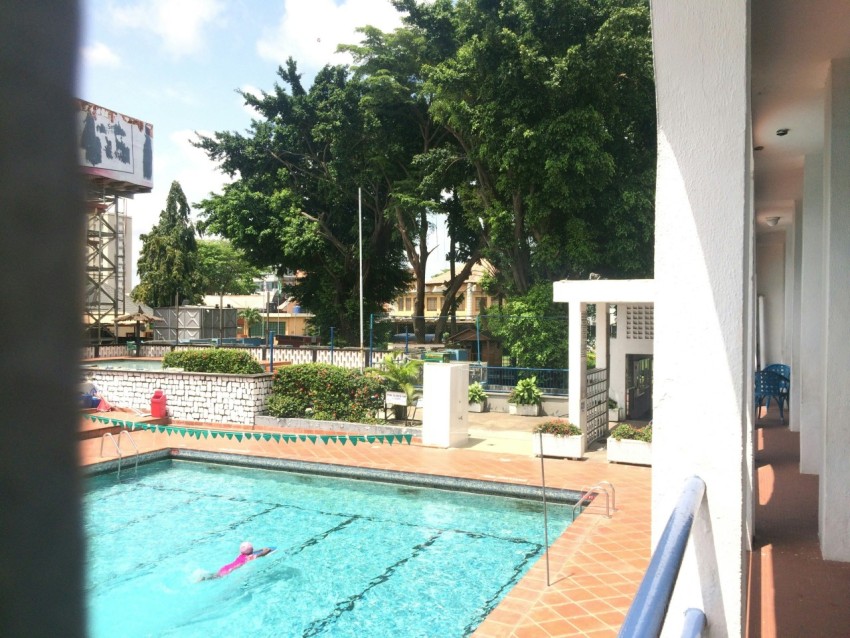 person swimming on pool