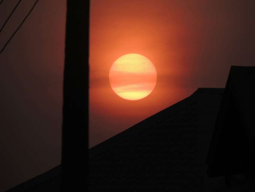 silhouette of building during sunset