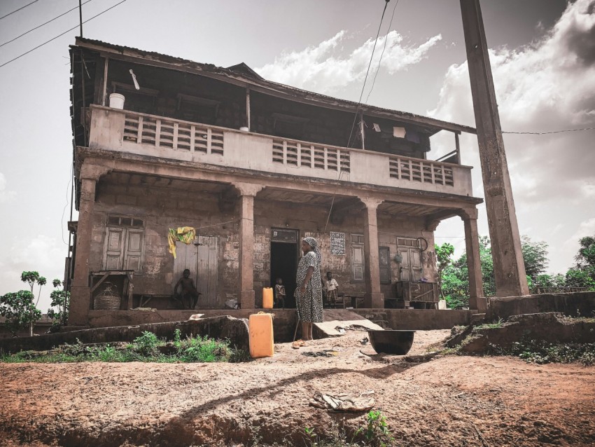 a person standing outside a house