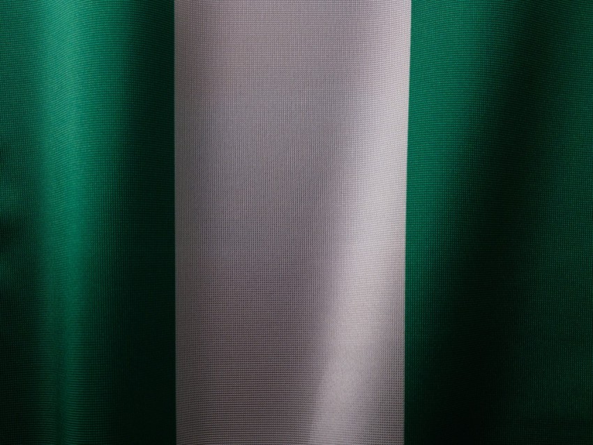 a close up of a green and white curtain