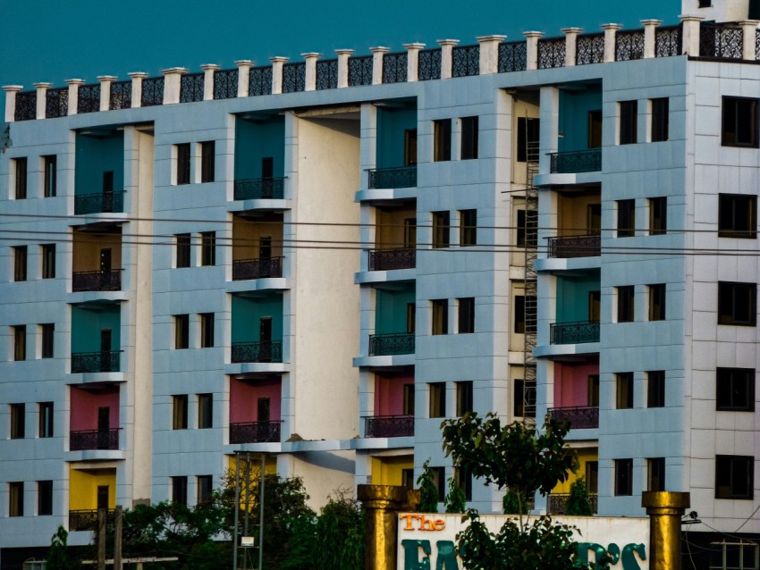 a tall building with balconies and balconies on the top of it