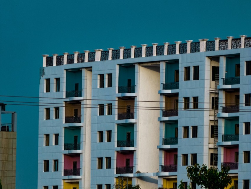 a tall building with multiple balconies and balconies on top of it