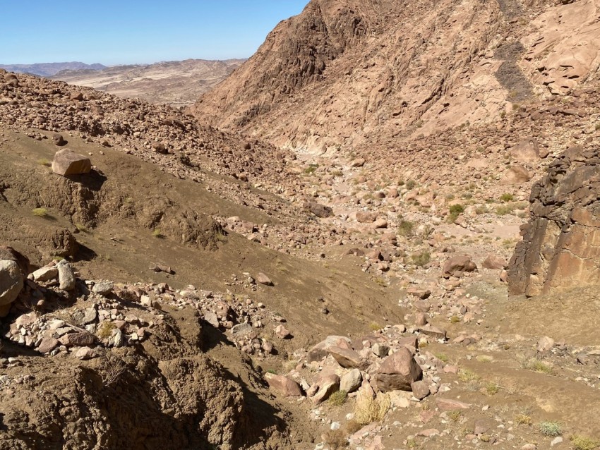 a view of a rocky area with a mountain in the background