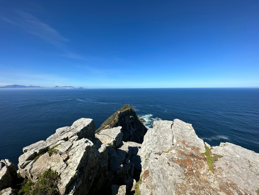 a view of the ocean from a rocky outcropping