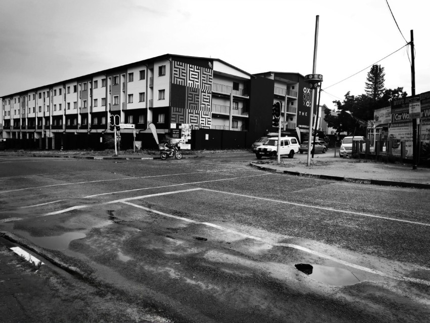 a black and white photo of an empty street