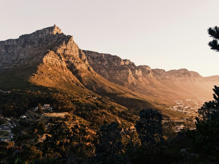 a view of a mountain with a city below it