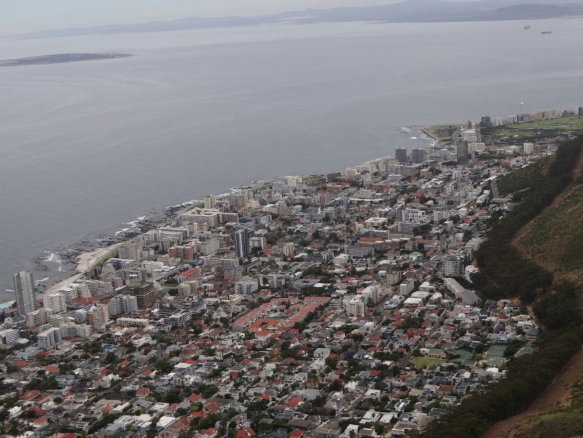 an aerial view of a city and a body of water