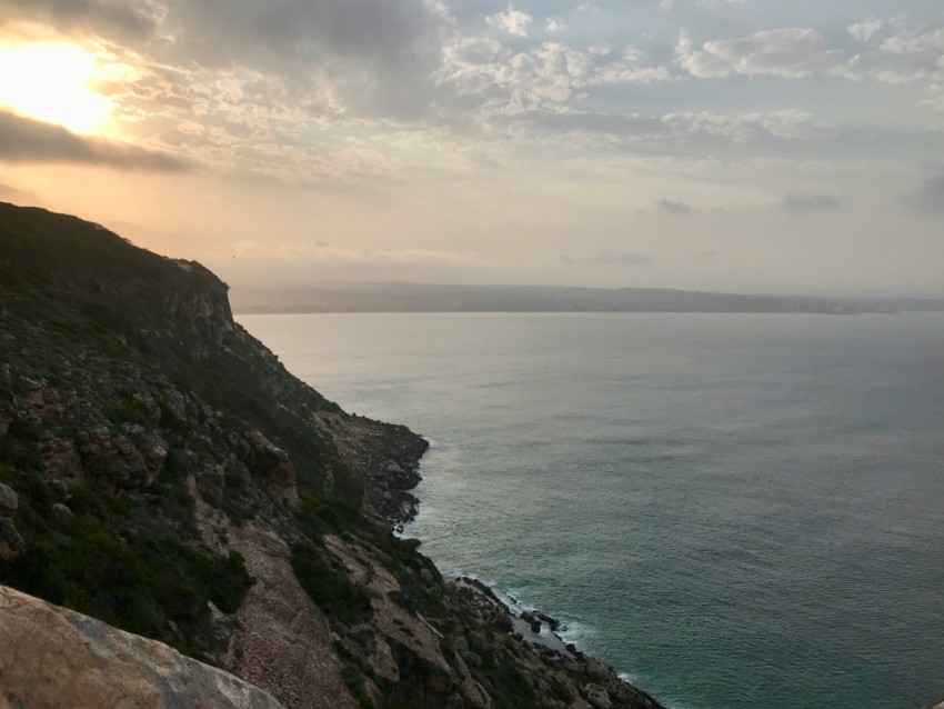 a view of a body of water from a cliff