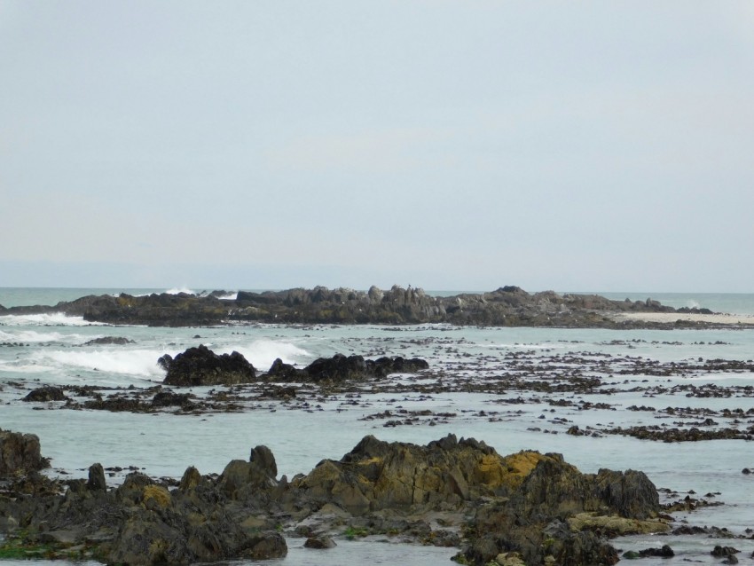 a large body of water surrounded by rocks wtJ2