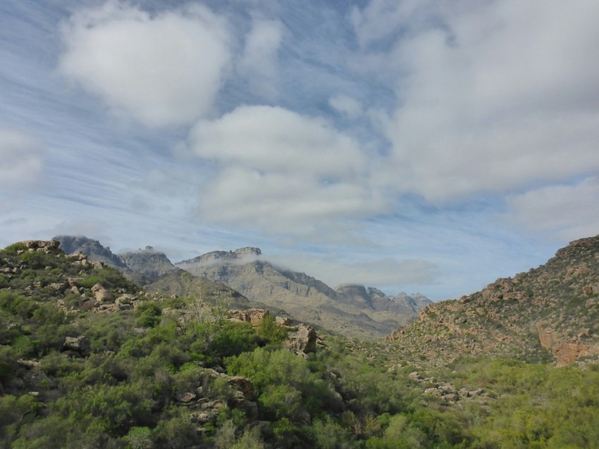 a view of a mountain range from a moving vehicle aOp