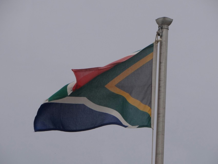 a flag flying in the wind on a pole Dn7r7 4_6