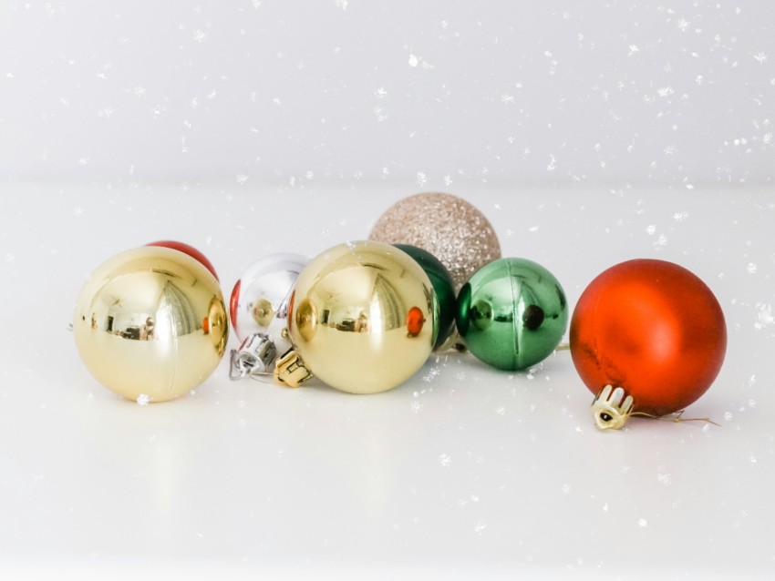 assorted color baubles on white surface