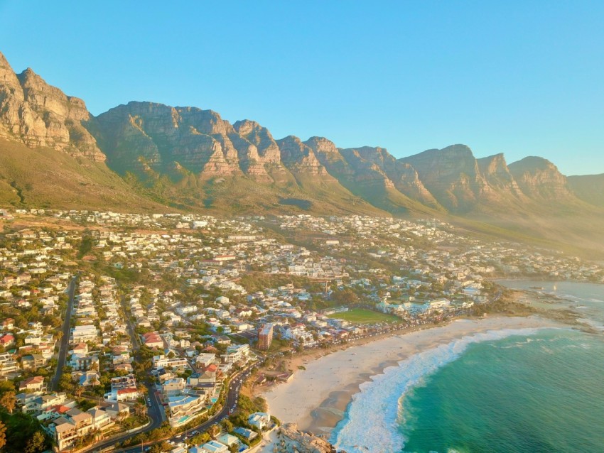 aerial view of city near body of water during daytime