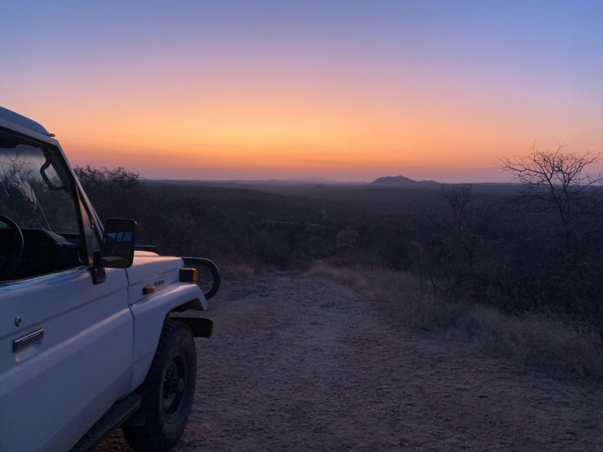 a car parked on a dirt road