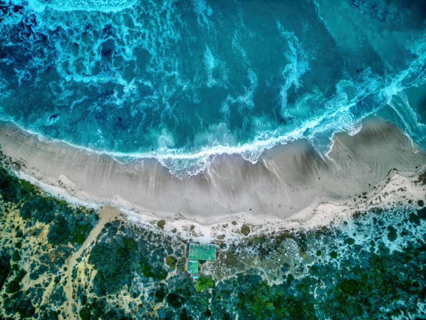 an aerial view of a beach and ocean