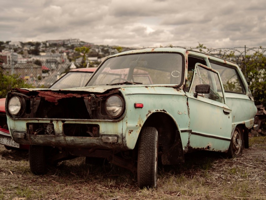 an old rusted out car