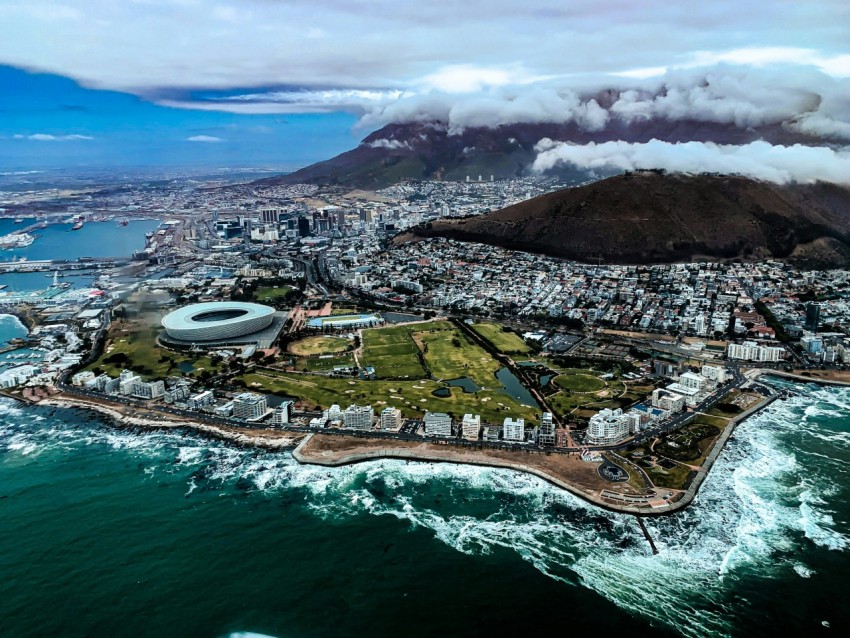 aerial view of city near body of water during daytime