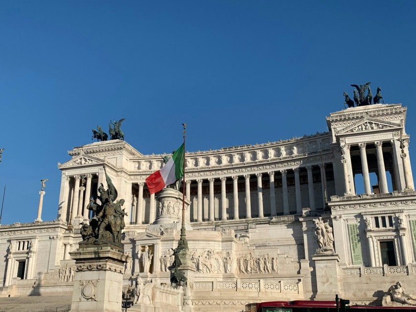 a large building with a statue in front of it