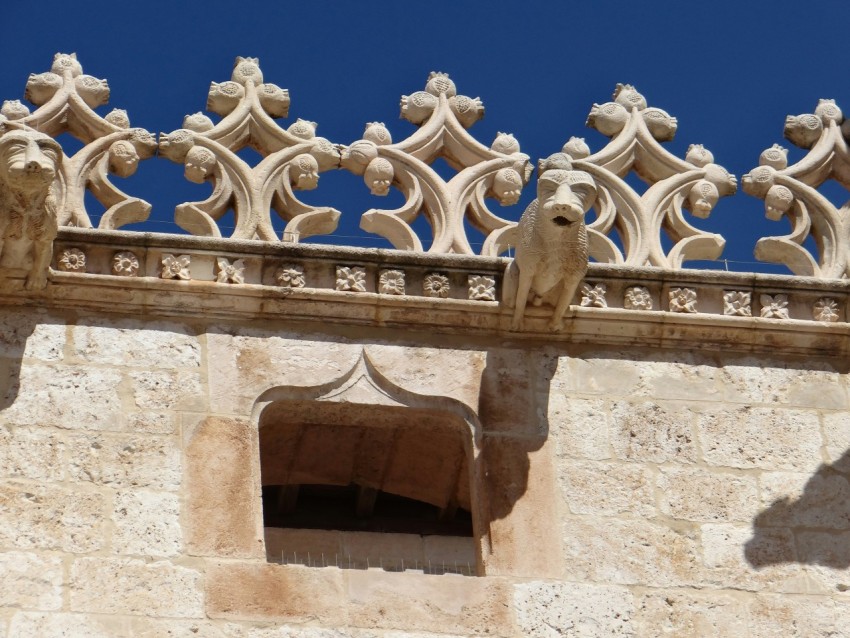 a close up of a building with a clock tower in the background