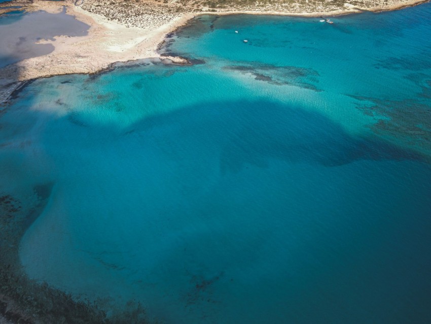 an aerial view of a beach and a body of water