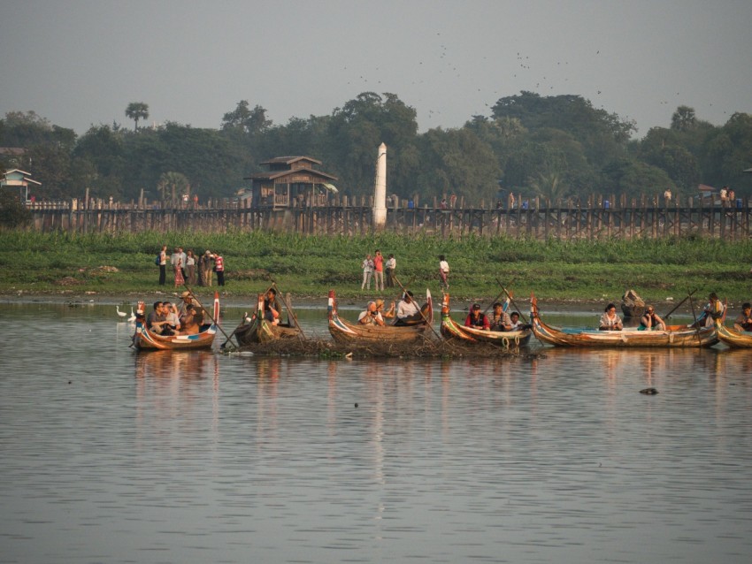 a group of people in canoes on a lake