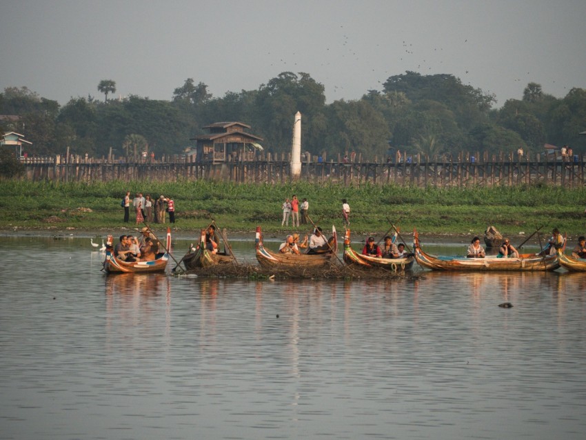 a group of people in canoes on a lake