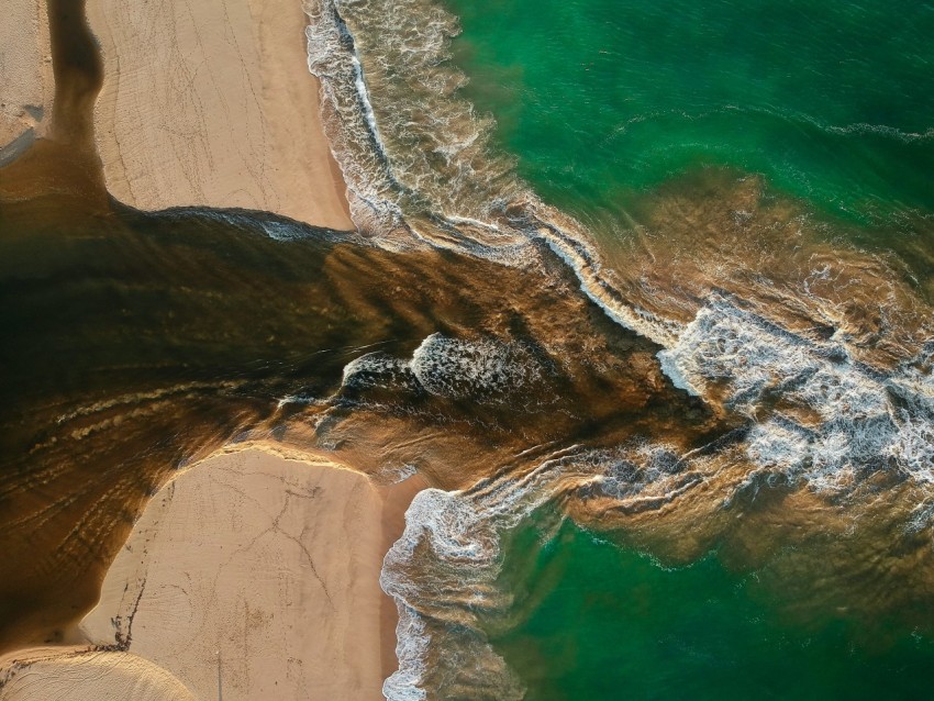 aerial photography of waves splashing on seashore