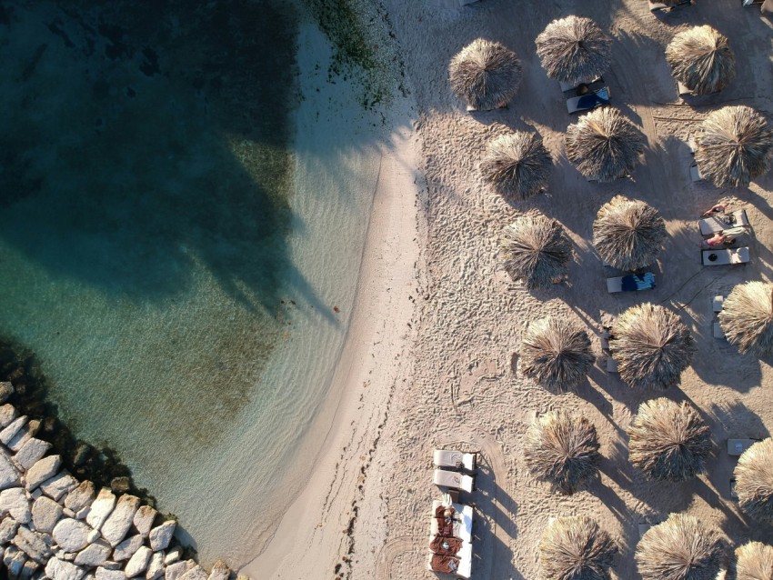 aerial view of huts at the shore