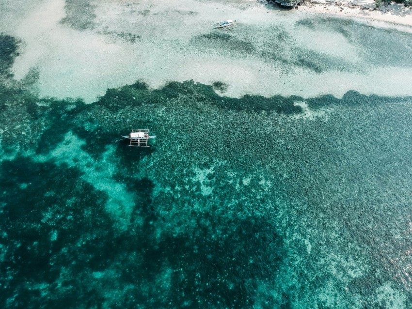 aerial photography of white boat on body of water during daytime ZkBWb3B6