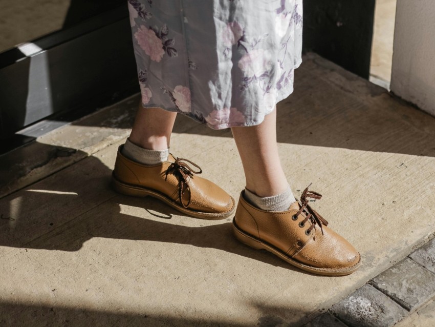 person wearing pair of brown leather shoes xBLbSOyrB