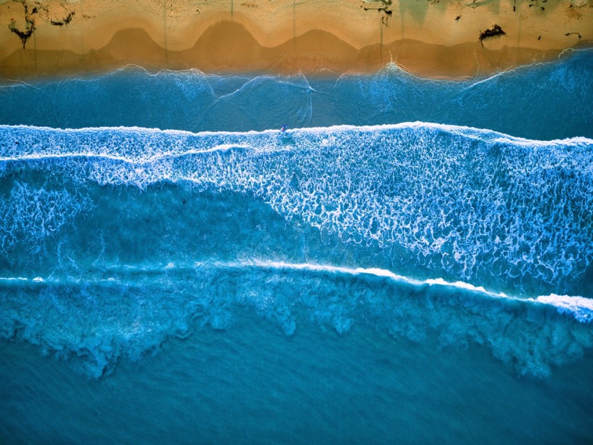 a wave crashing on a beach