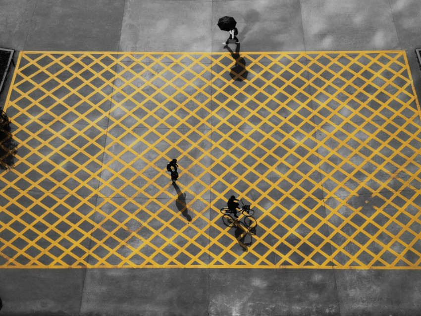 3 men walking on white and blue floor tiles