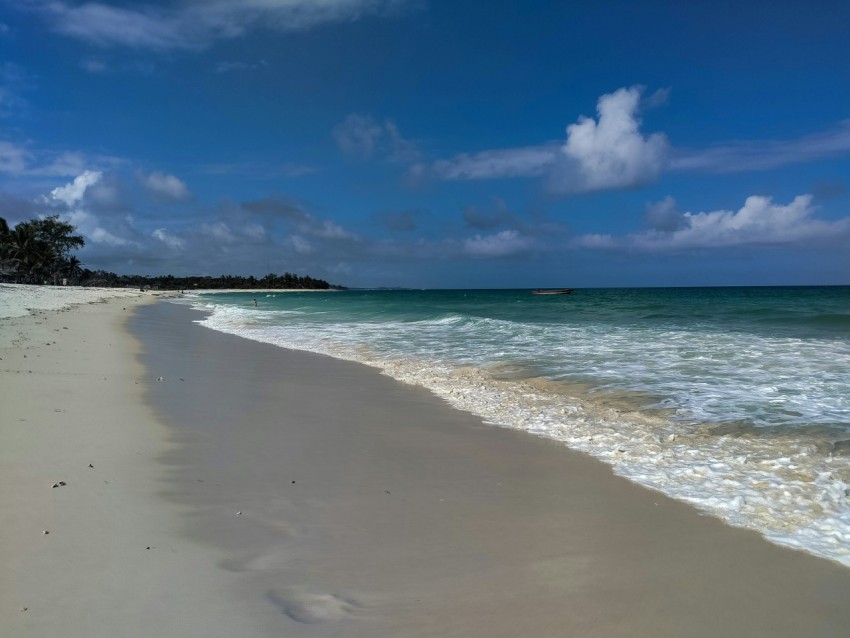 a beach with clear blue water