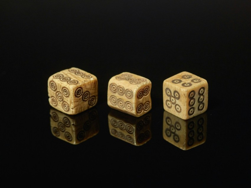 a pair of wooden dices sitting on top of a table