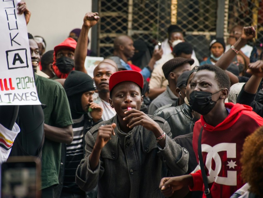 a group of people standing around each other