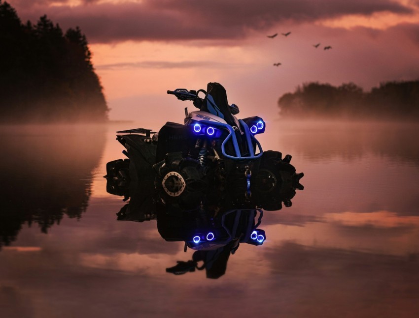 a motorcycle that is sitting in the water YbGSaBPbB