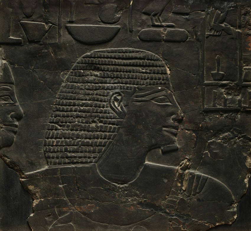 an ancient painting of a mans head