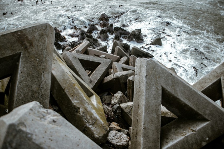 brown wooden ladder on rocky shore during daytime