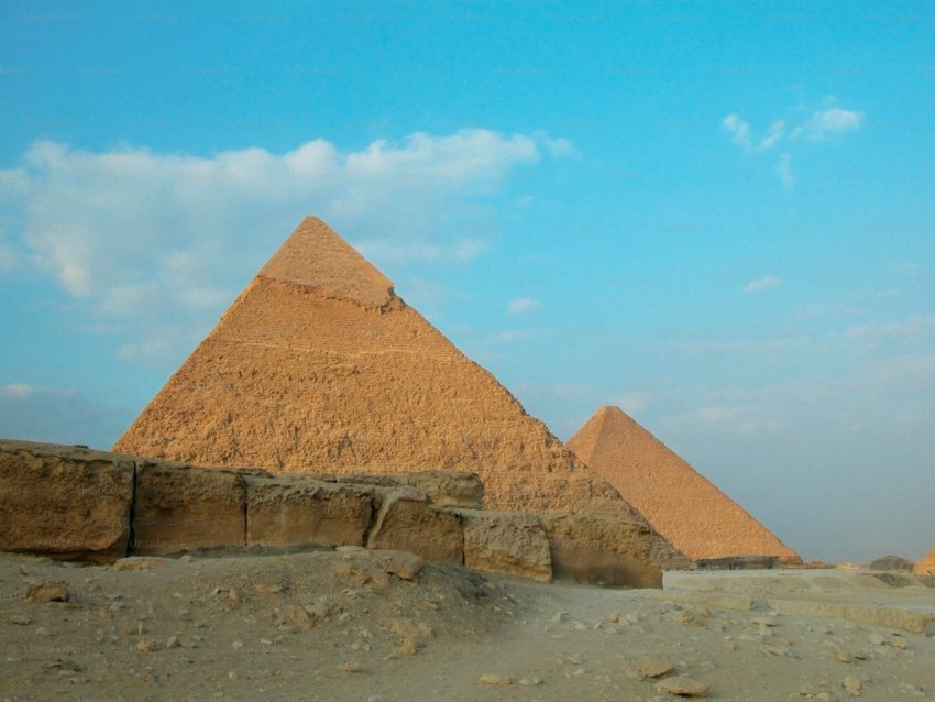 the pyramids of giza are shown against a blue sky