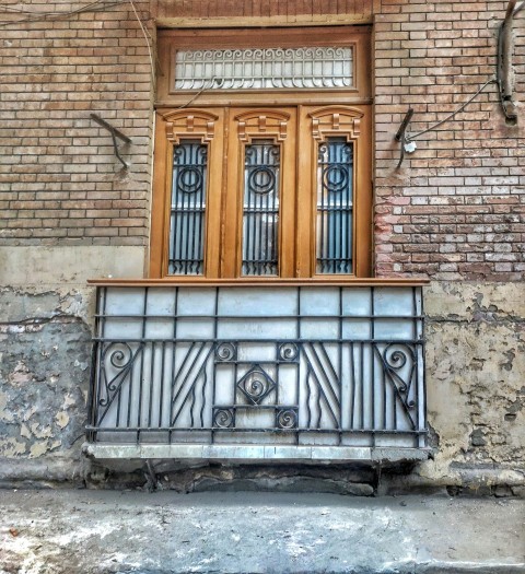 a building with two doors and a window