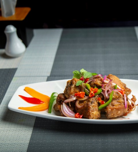 a white plate topped with meat and veggies Ebt