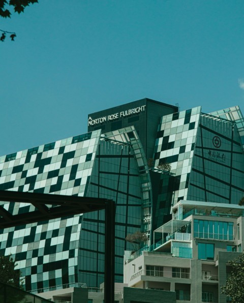 green concrete building under blue sky during daytime