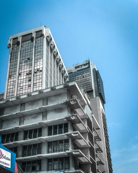 white concrete building under blue sky during daytime