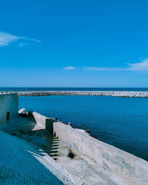 a view of a body of water from a bridge