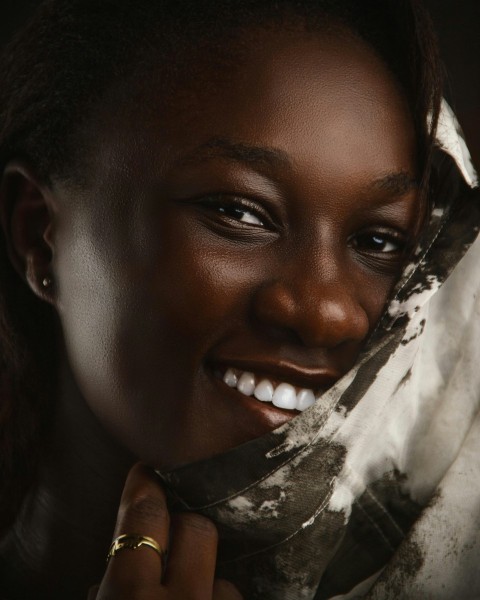 a close up of a person wearing a scarf