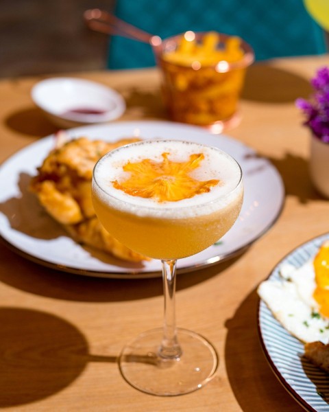 a table topped with plates of food and drinks